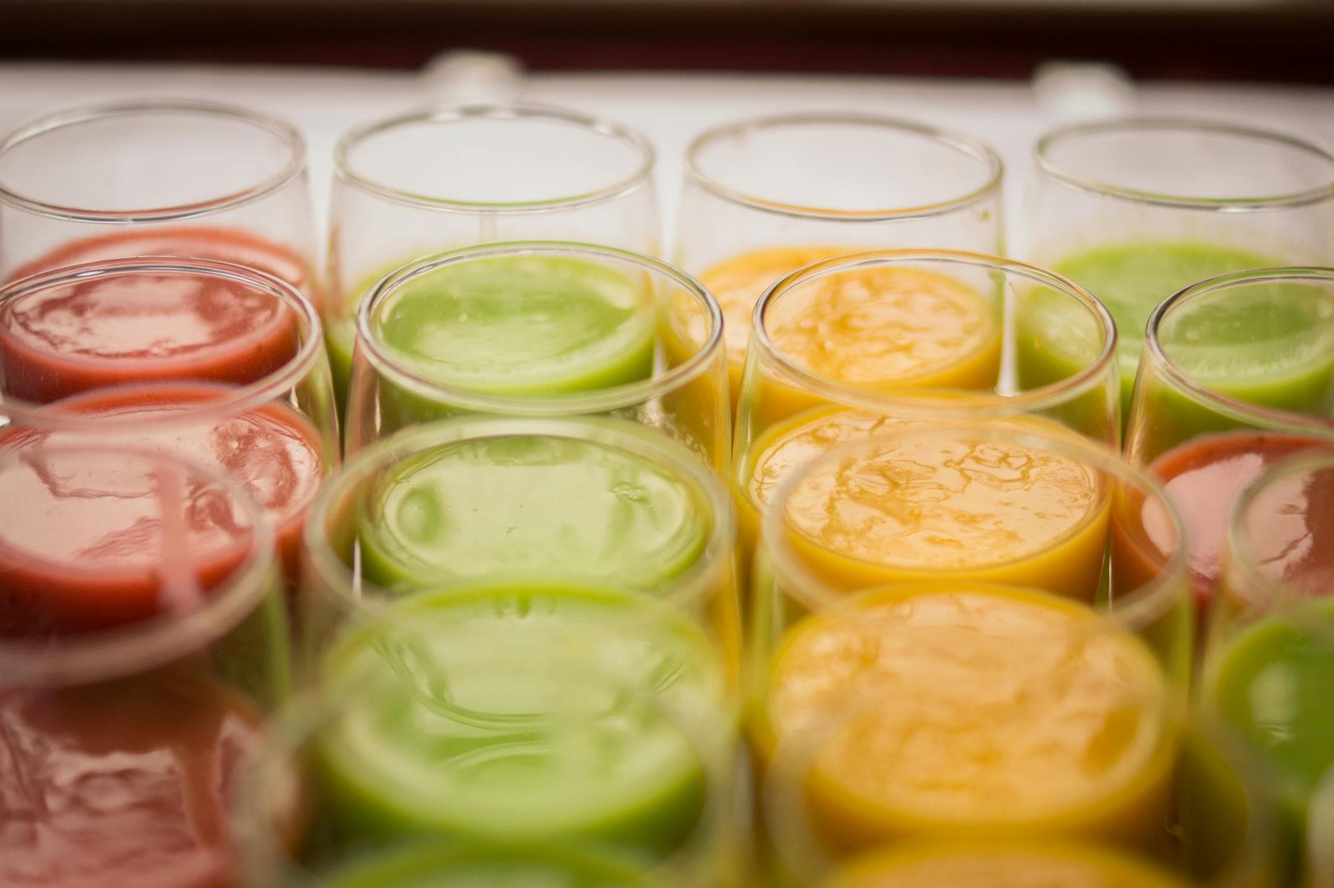 Row of colorful cold-pressed juices